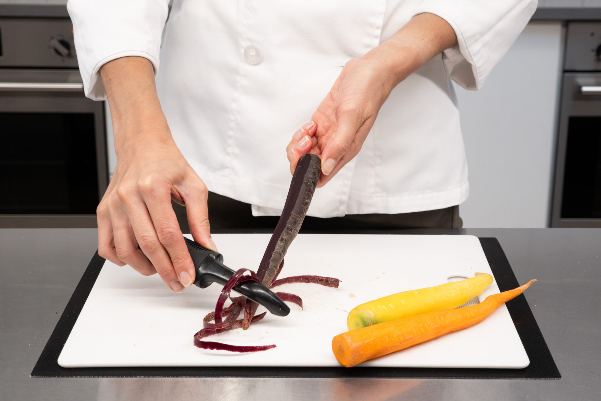 Peeling carrots during a Montessori cooking activity
